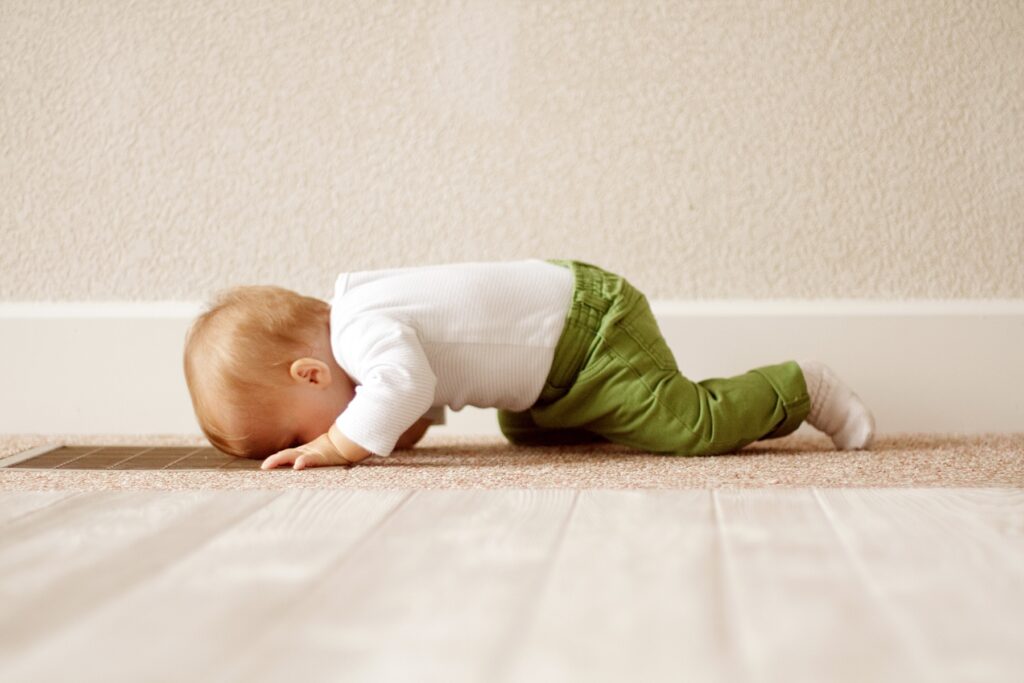 Baby resting with head down during tummy time